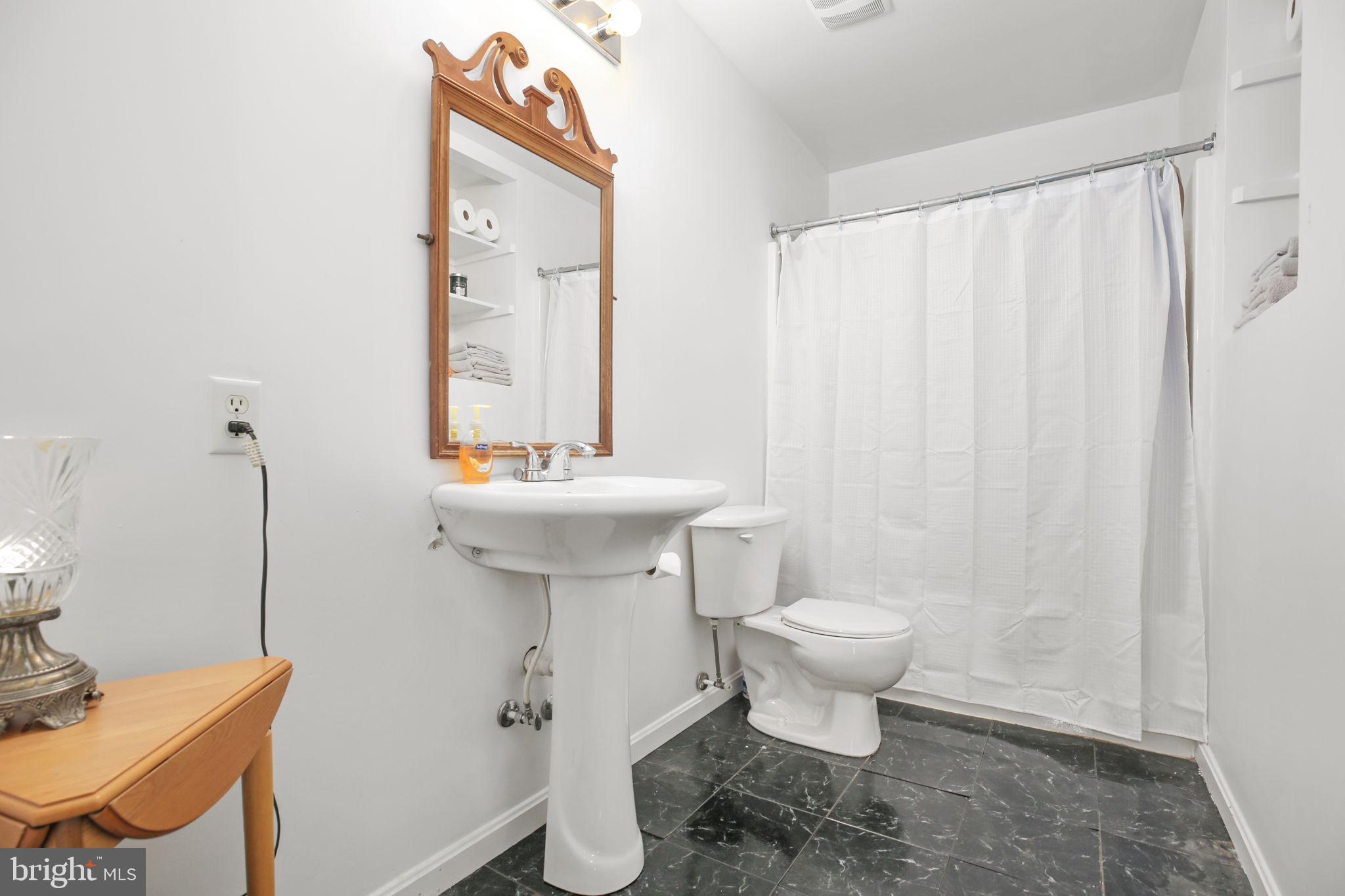 315 Sandy Ridge Road Fredericksburg, VA 22405 - Photo 21 of 42 a bathroom with a sink toilet and a mirror