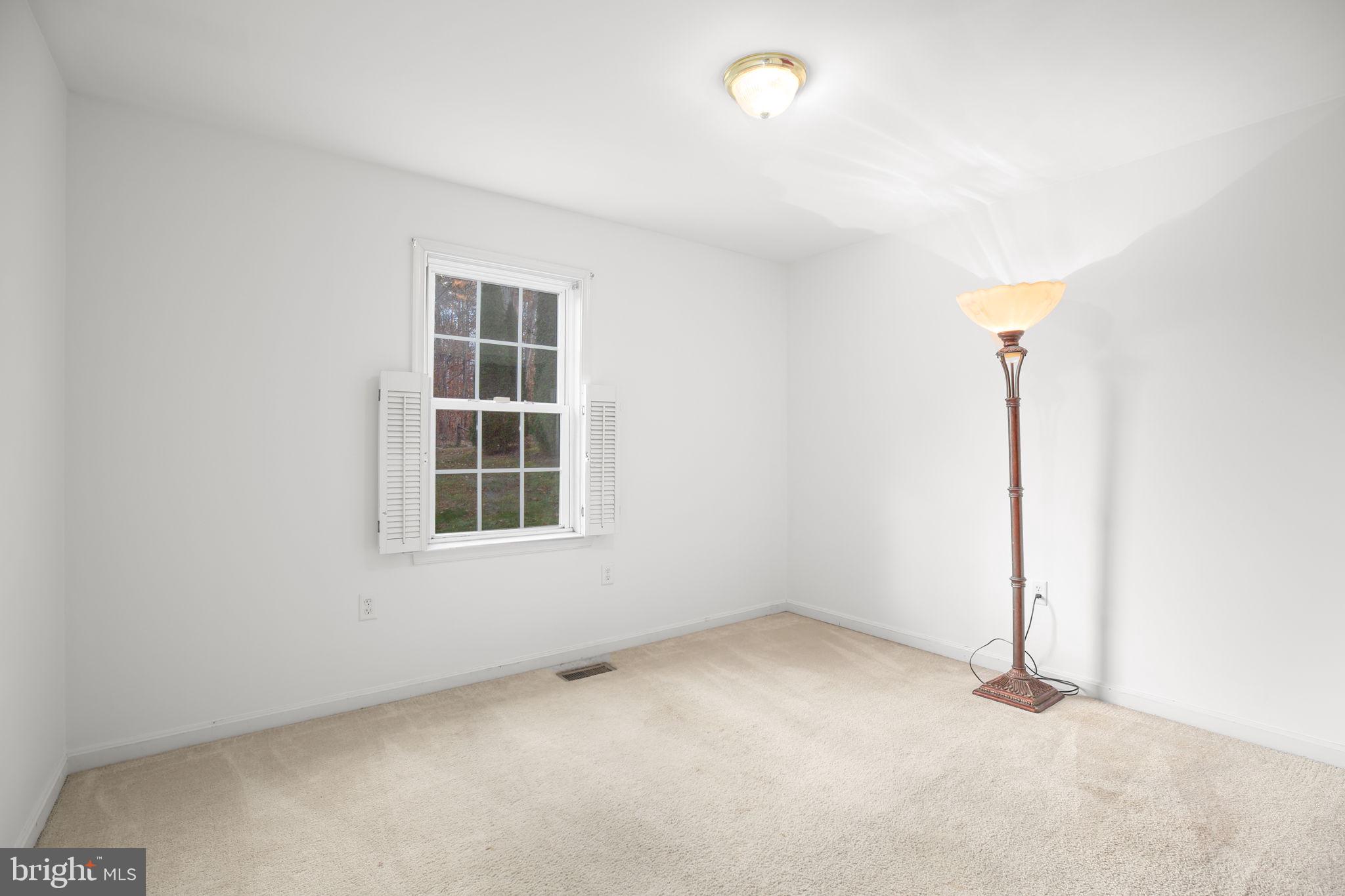 315 Sandy Ridge Road Fredericksburg, VA 22405 - Photo 22 of 42 an empty room with windows