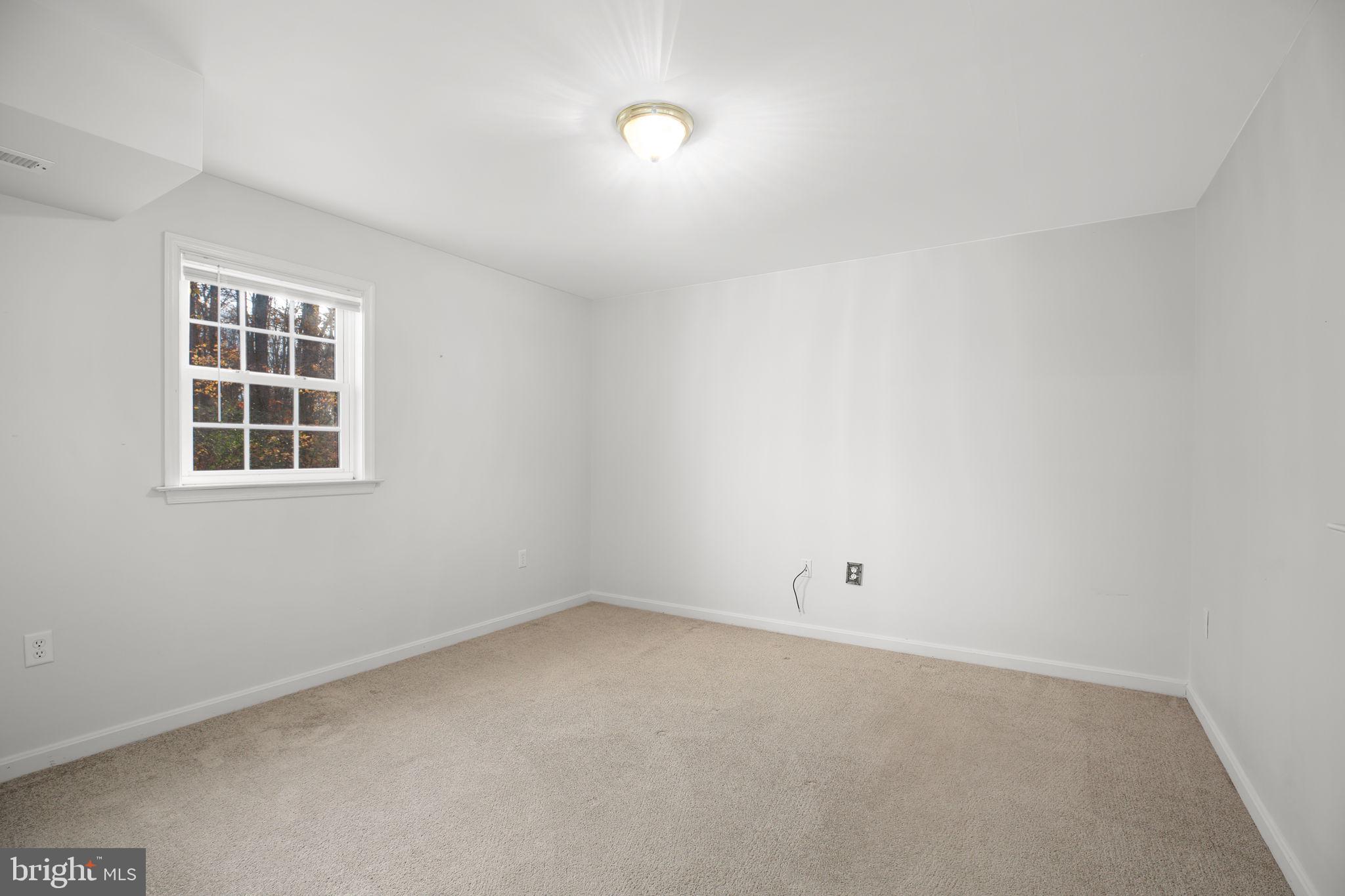 315 Sandy Ridge Road Fredericksburg, VA 22405 - Photo 31 of 42 an empty room with a window