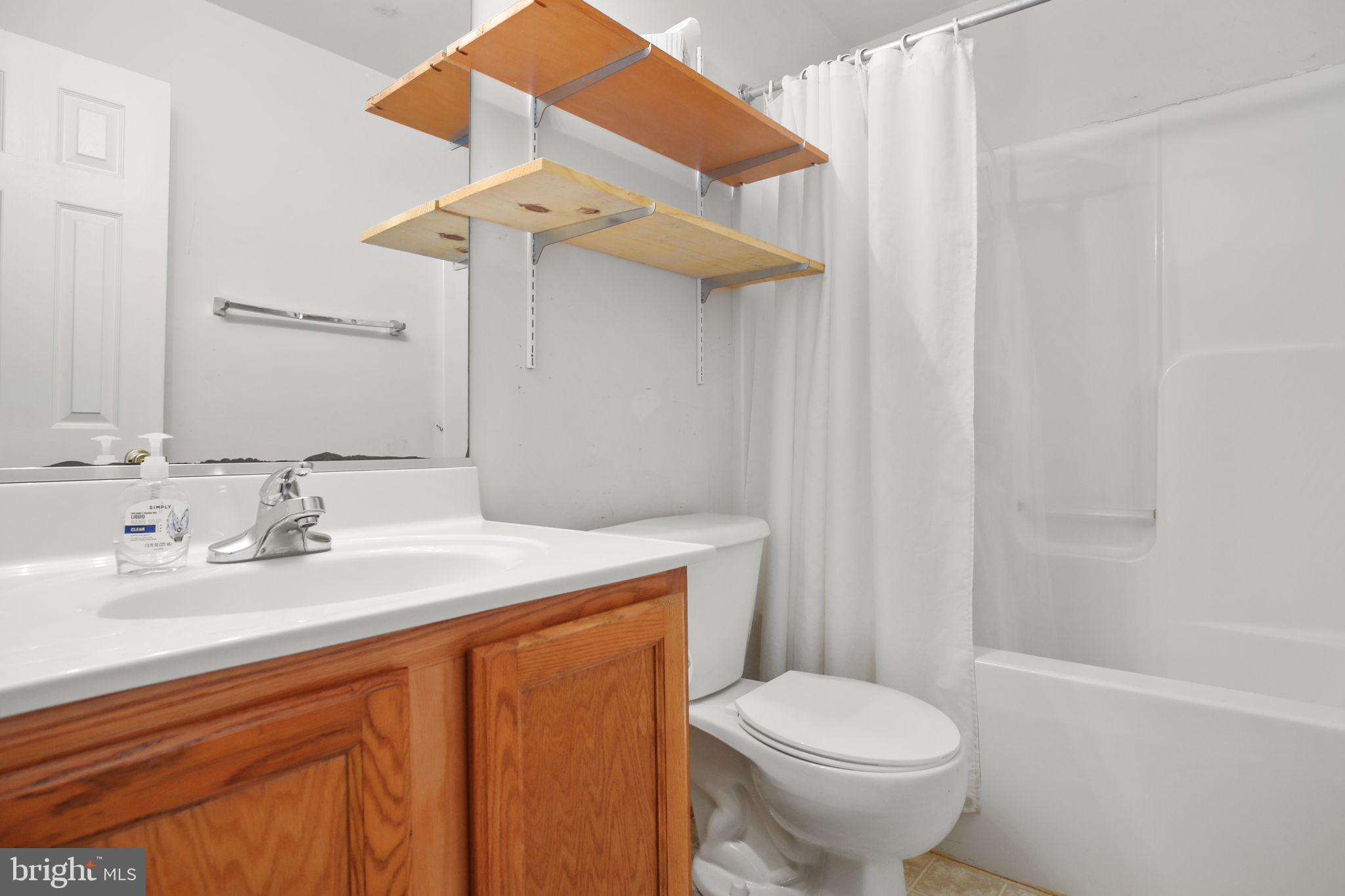 315 Sandy Ridge Road Fredericksburg, VA 22405 - Photo 32 of 42 a bathroom with a sink a toilet and shower