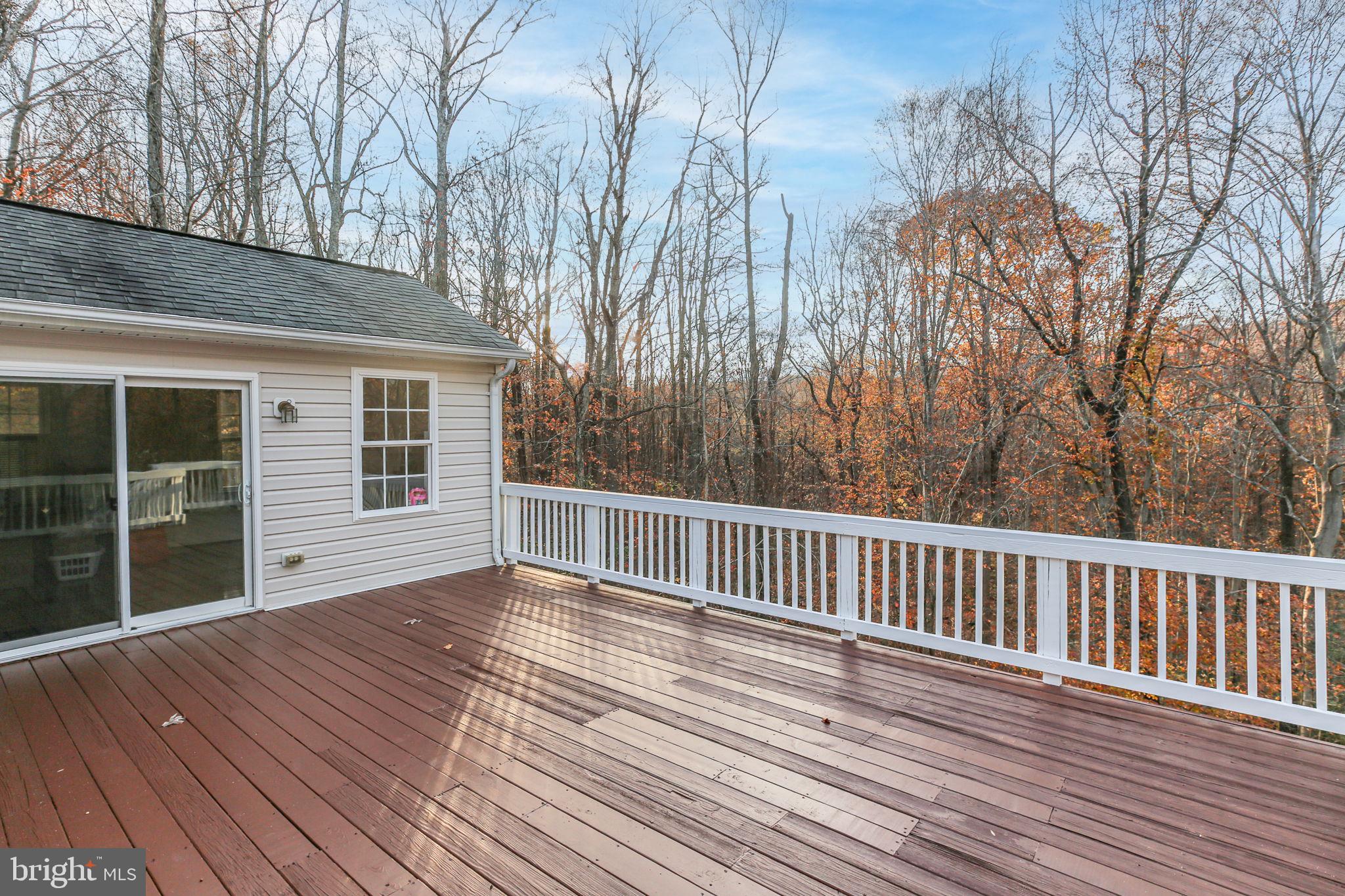 315 Sandy Ridge Road Fredericksburg, VA 22405 - Photo 35 of 42 a view of backyard with deck and wooden floor