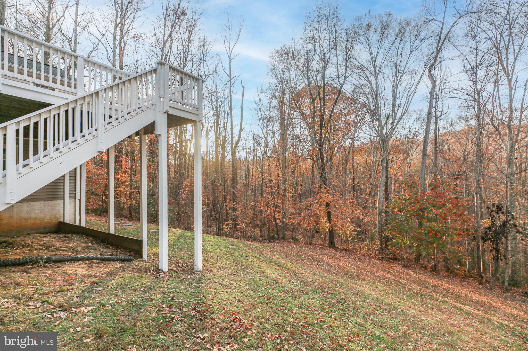 315 Sandy Ridge Road Fredericksburg, VA 22405 - Photo 37 of 42 a view of a house with backyard and wooden fence