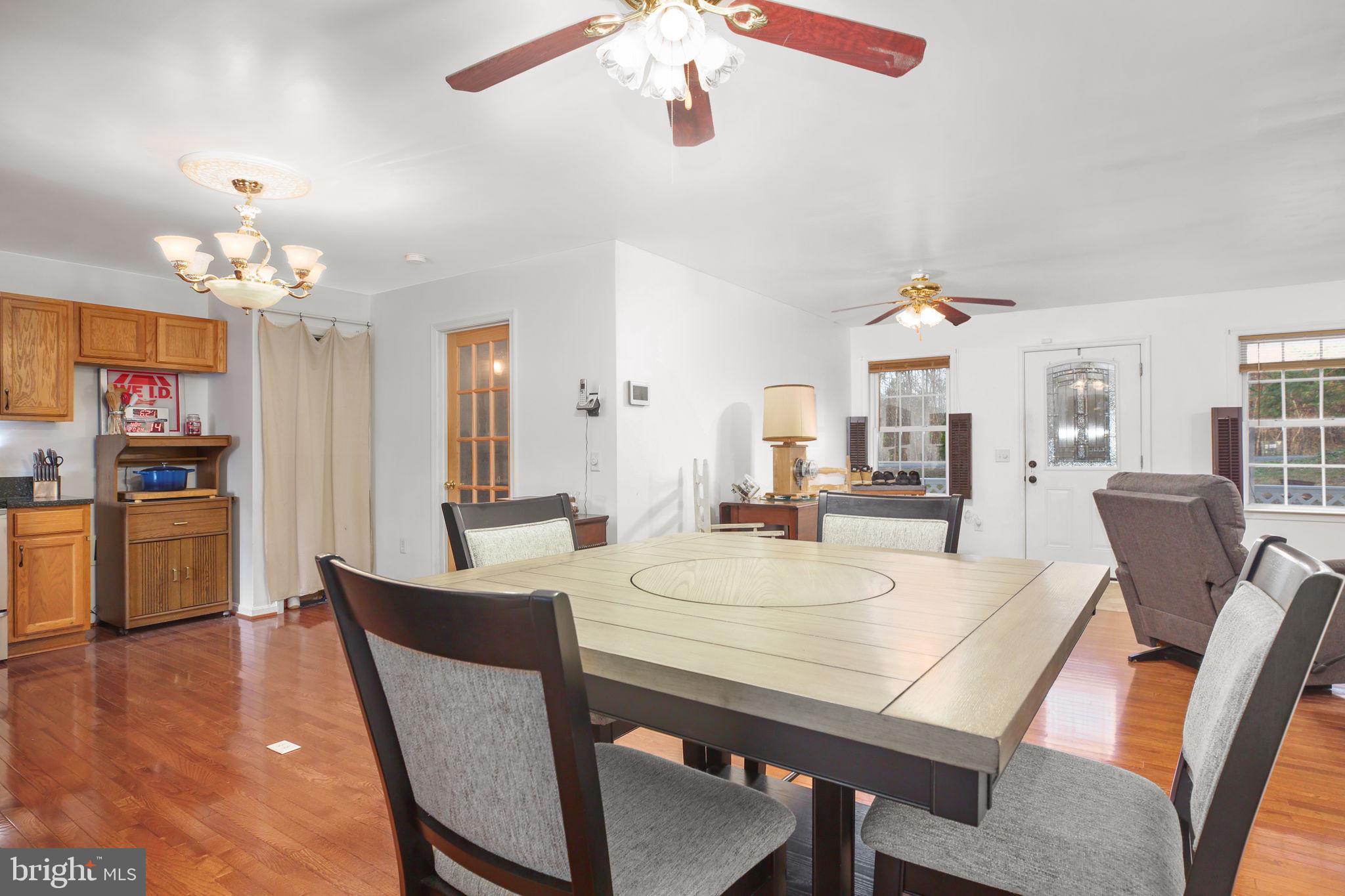 315 Sandy Ridge Road Fredericksburg, VA 22405 - Photo 8 of 42 a view of a dining room with furniture and wooden floor