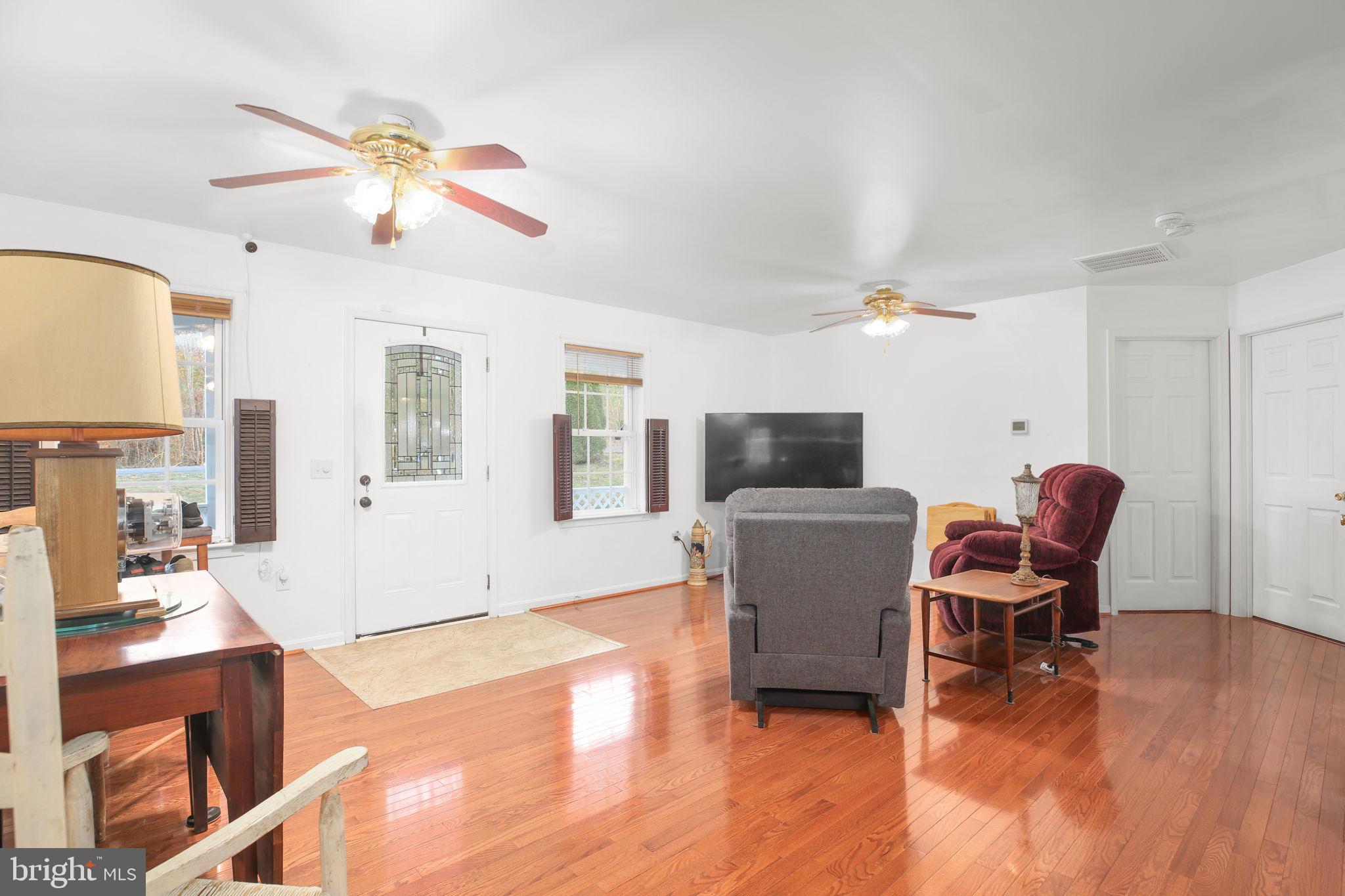 315 Sandy Ridge Road Fredericksburg, VA 22405 - Photo 10 of 42 a living room with furniture and a flat screen tv