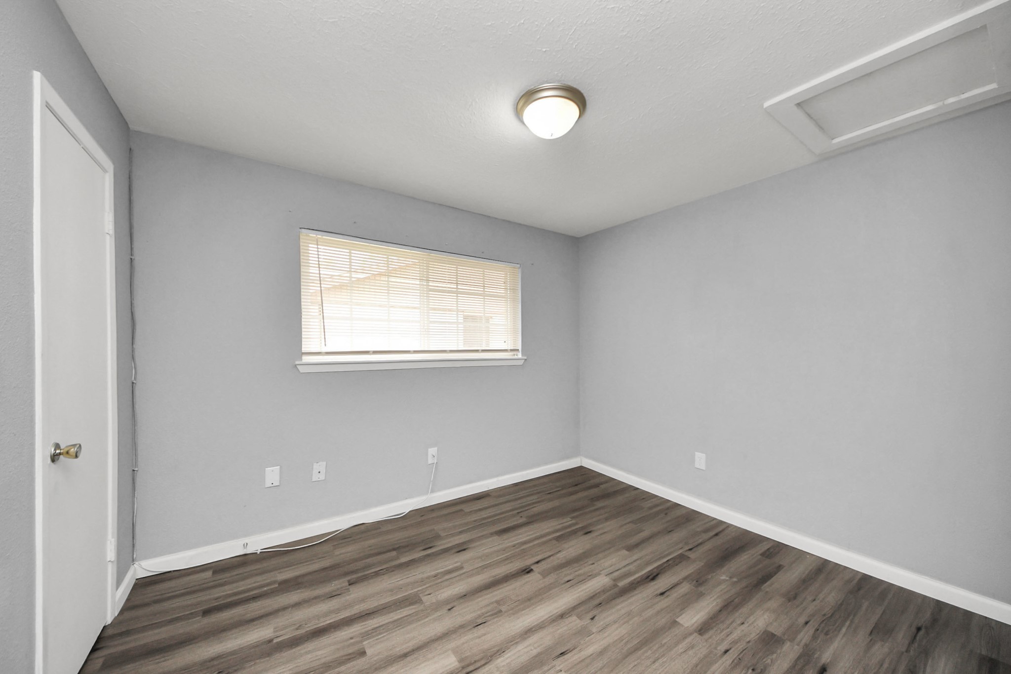 11510 Lockgate Lane Houston, TX 77048 - Photo 14 of 22 wooden floor in an empty room with a window