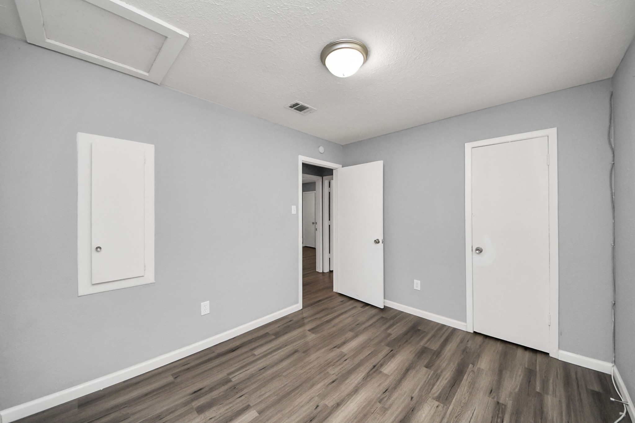 11510 Lockgate Lane Houston, TX 77048 - Photo 15 of 22 a view of an empty room with wooden floor