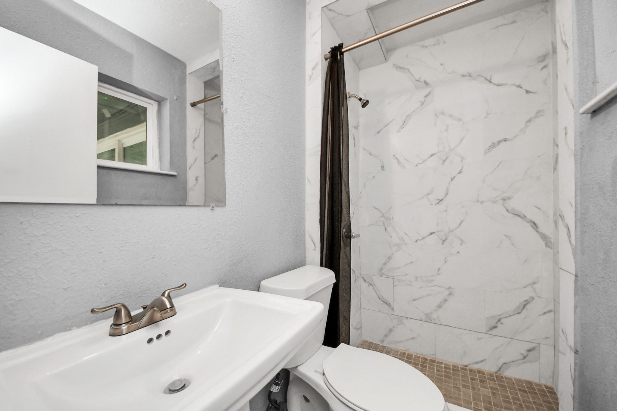 11510 Lockgate Lane Houston, TX 77048 - Photo 17 of 22 a bathroom with a sink toilet and shower