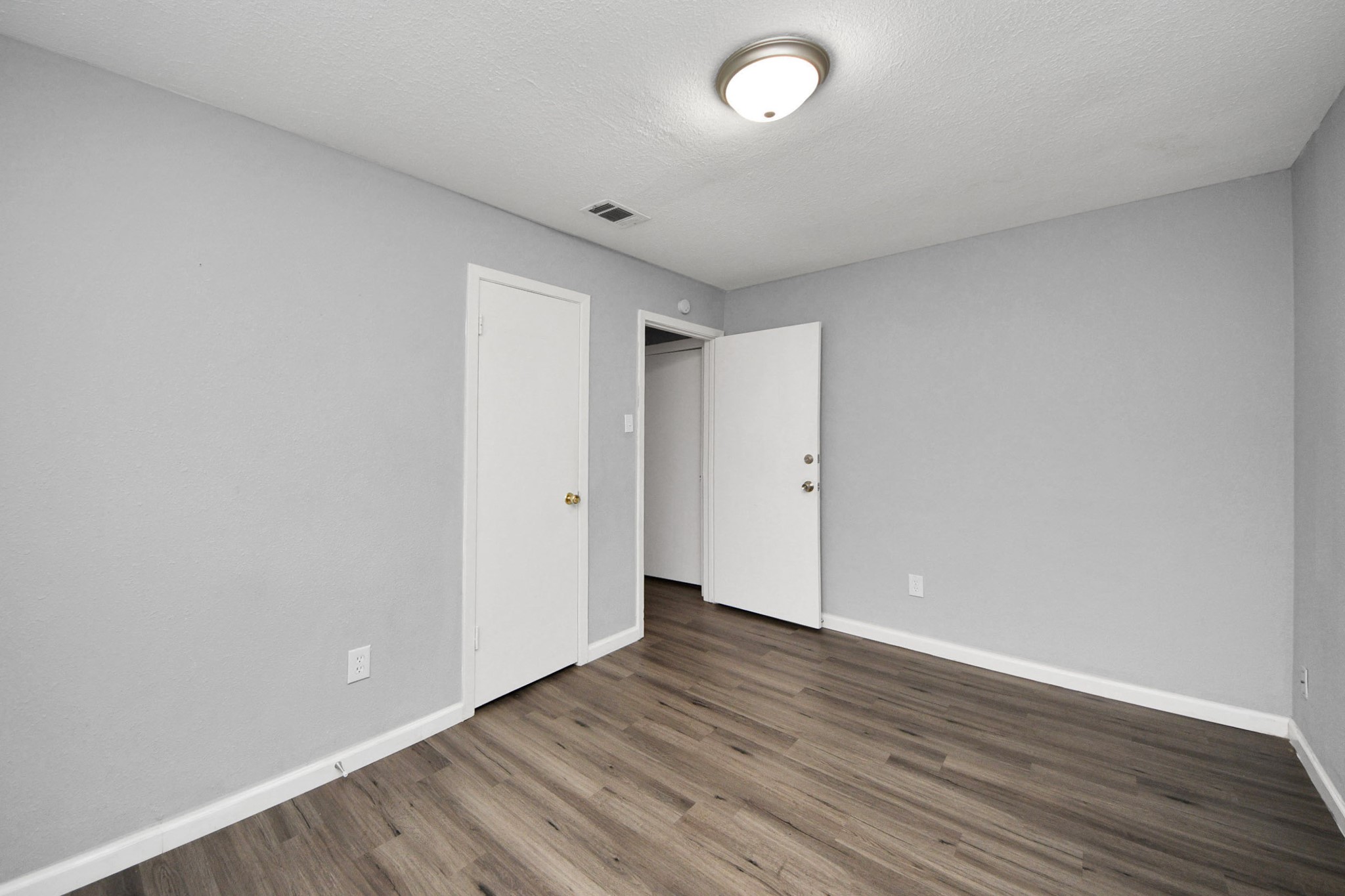 11510 Lockgate Lane Houston, TX 77048 - Photo 20 of 22 a view of an empty room with wooden floor