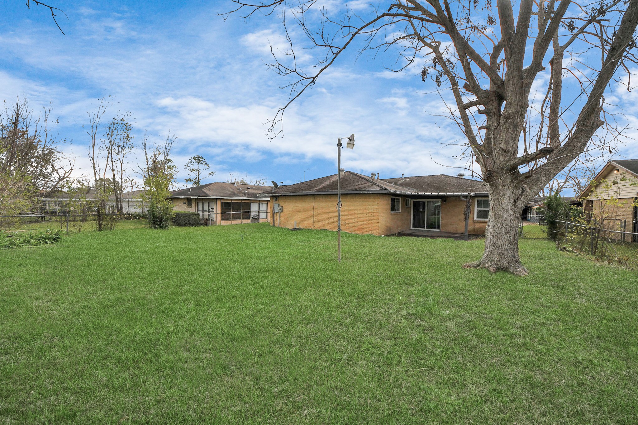 11510 Lockgate Lane Houston, TX 77048 - Photo 21 of 22 a front view of a house with a yard
