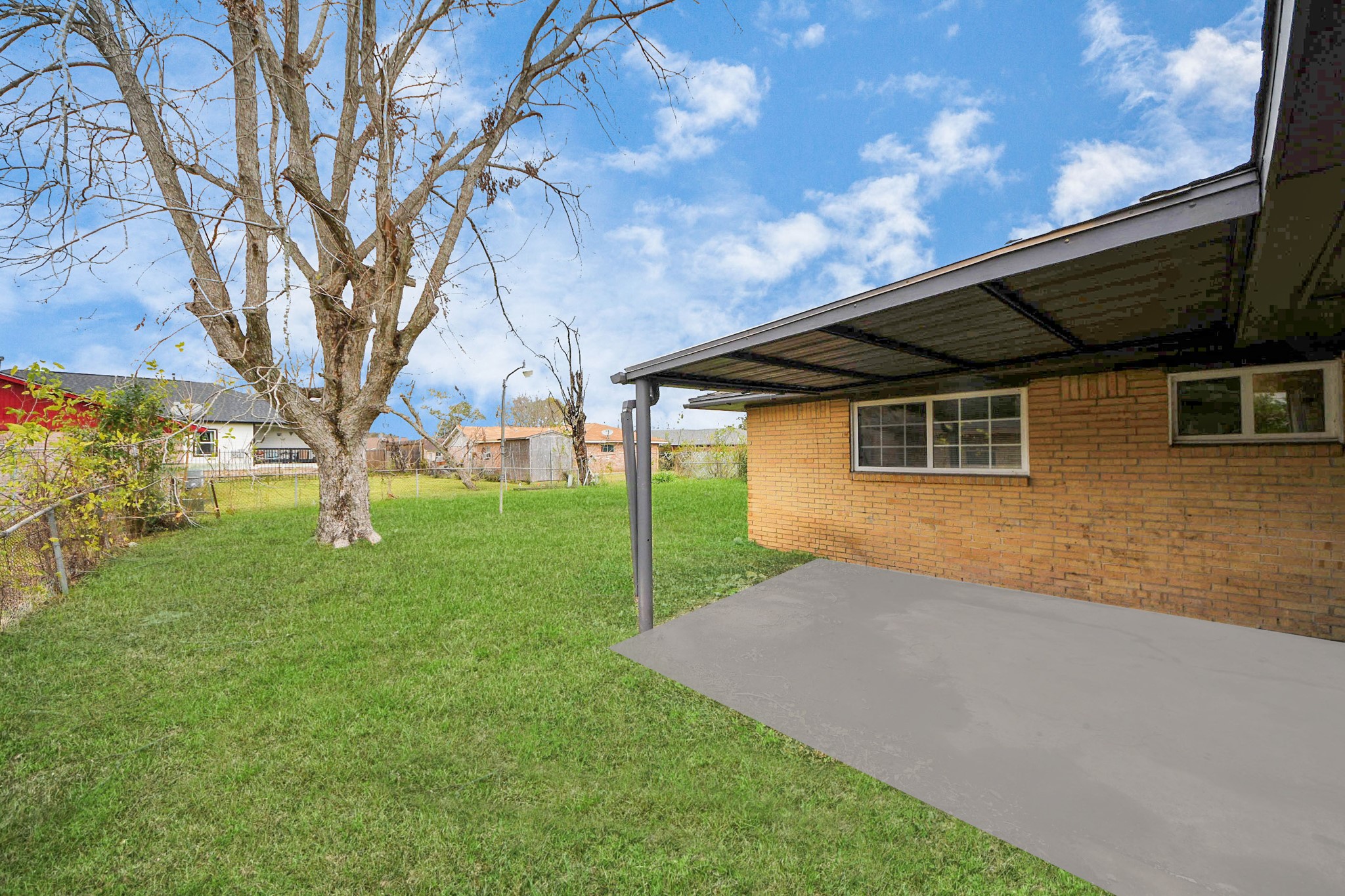 11510 Lockgate Lane Houston, TX 77048 - Photo 22 of 22 a view of a house with backyard and a tree