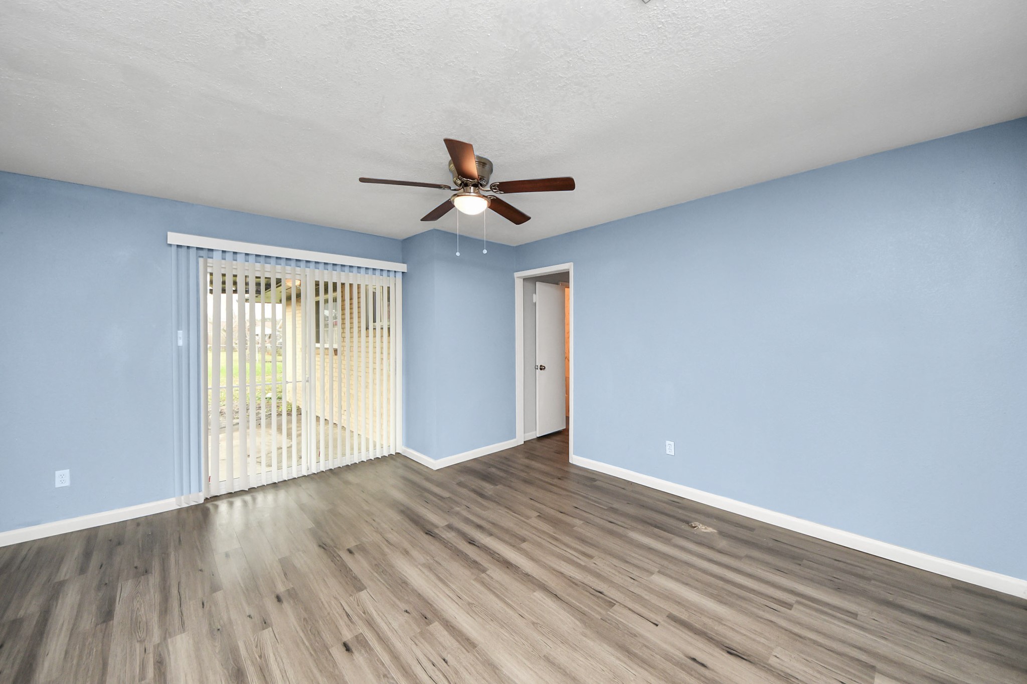 11510 Lockgate Lane Houston, TX 77048 - Photo 7 of 22 a view of room with wooden floor and ceiling fan