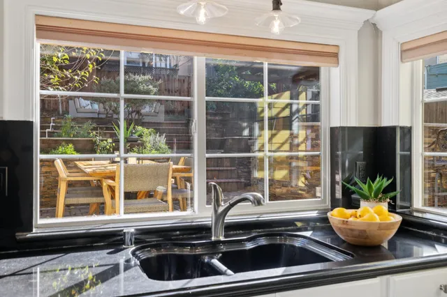 a kitchen with a sink and a window