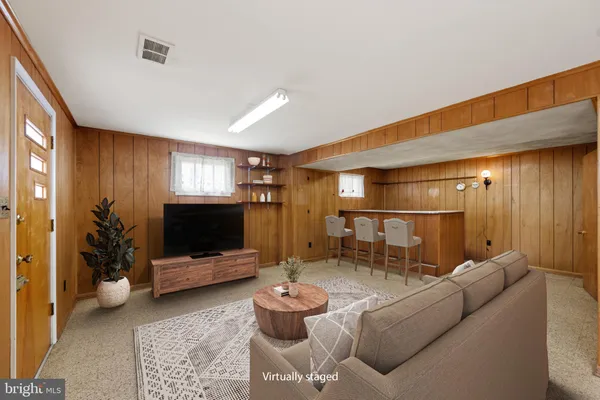 an empty room with a empty space and windows