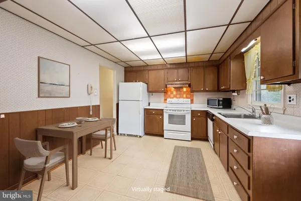 a kitchen with cabinets and steel stainless steel appliances