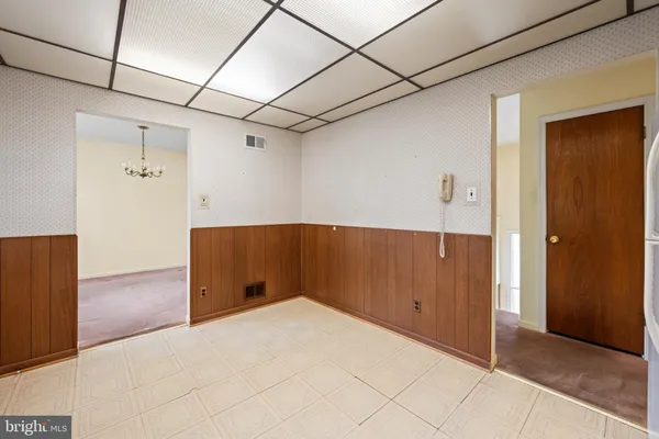 a view of empty room with windows