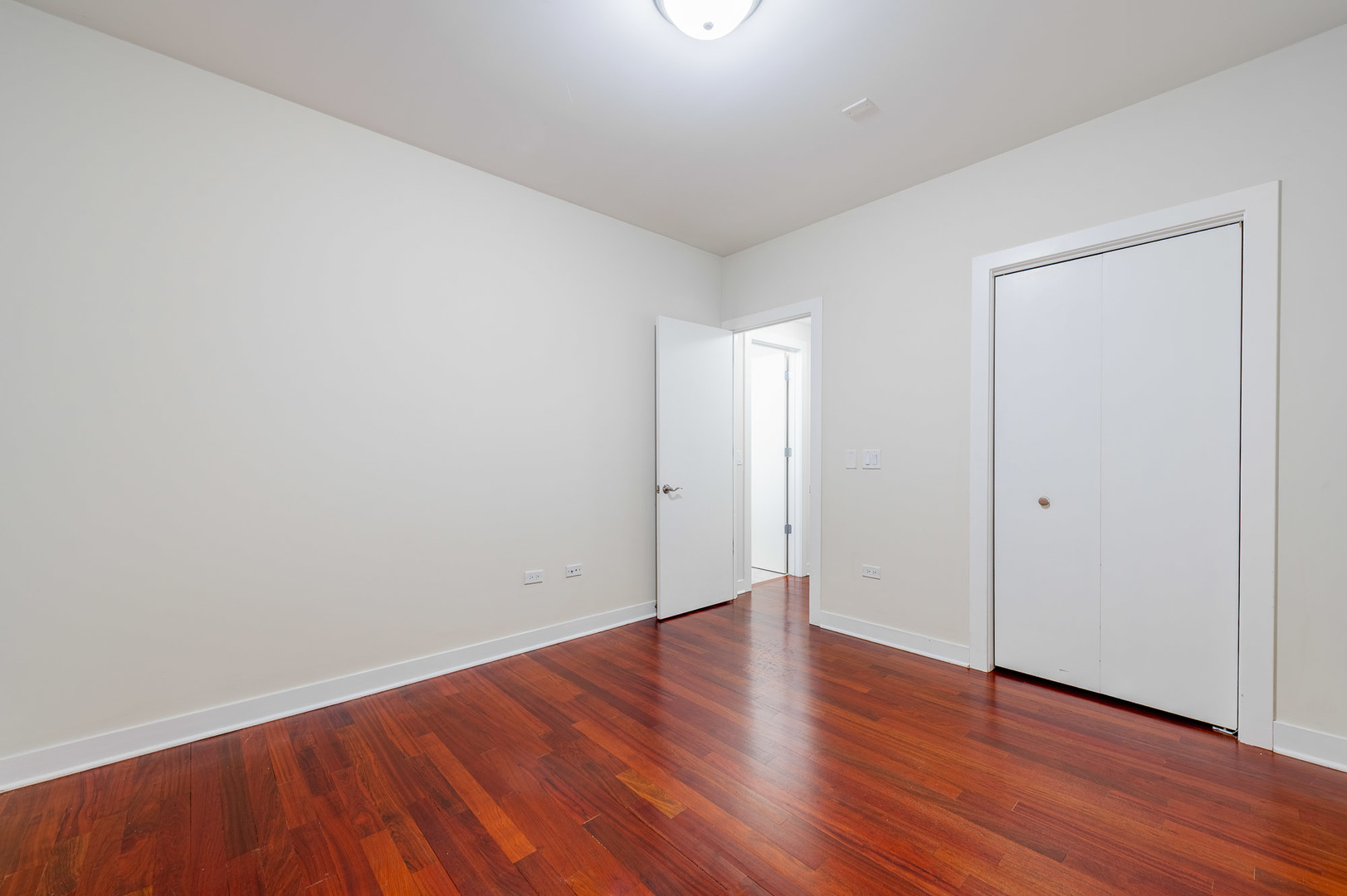 1162 West Hubbard Street, Unit 203 Chicago, IL 60642 - Photo 16 of 22 a view of an empty room with wooden floor