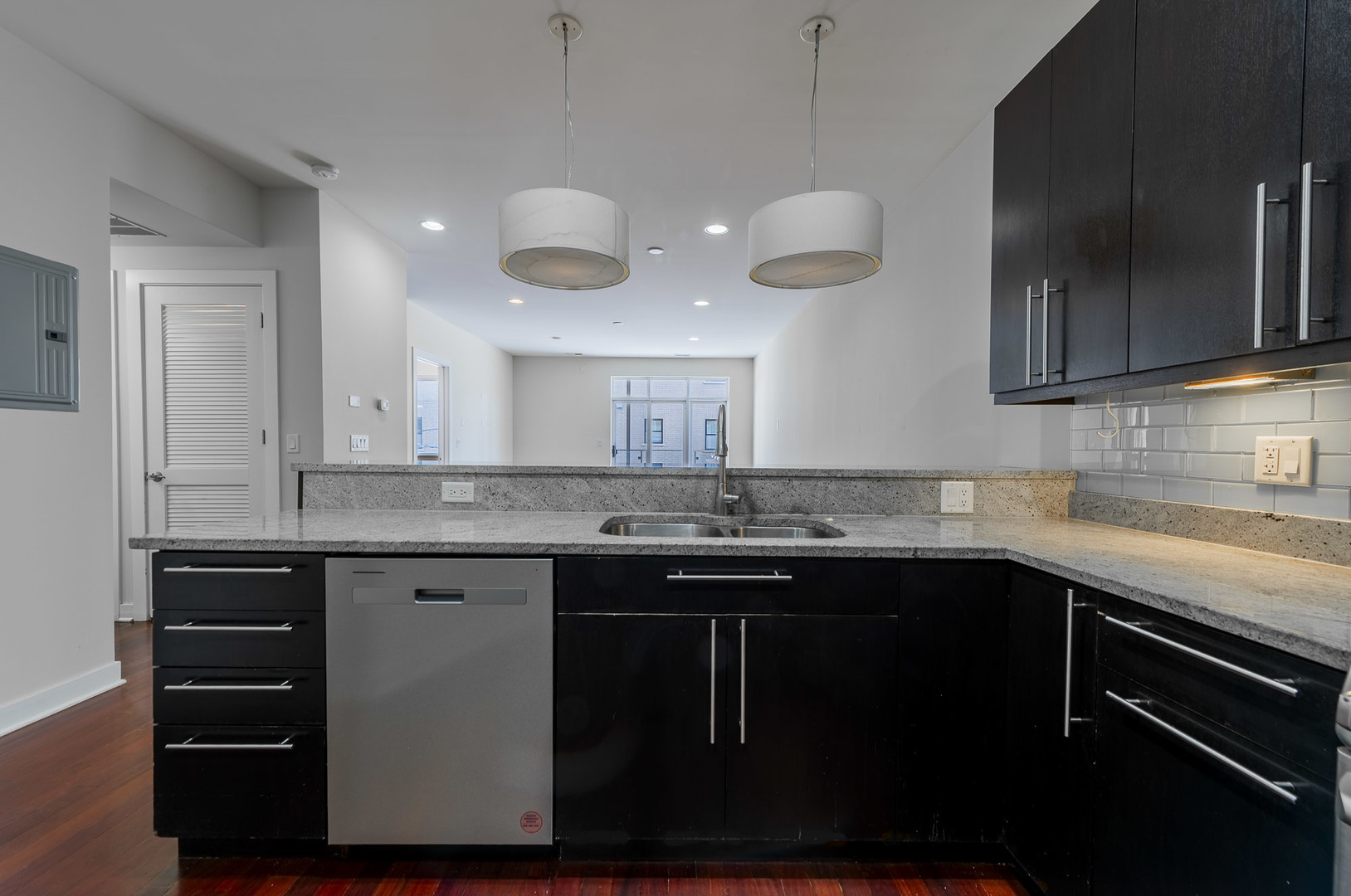 1162 West Hubbard Street, Unit 203 Chicago, IL 60642 - Photo 4 of 22 a kitchen with a sink and cabinets