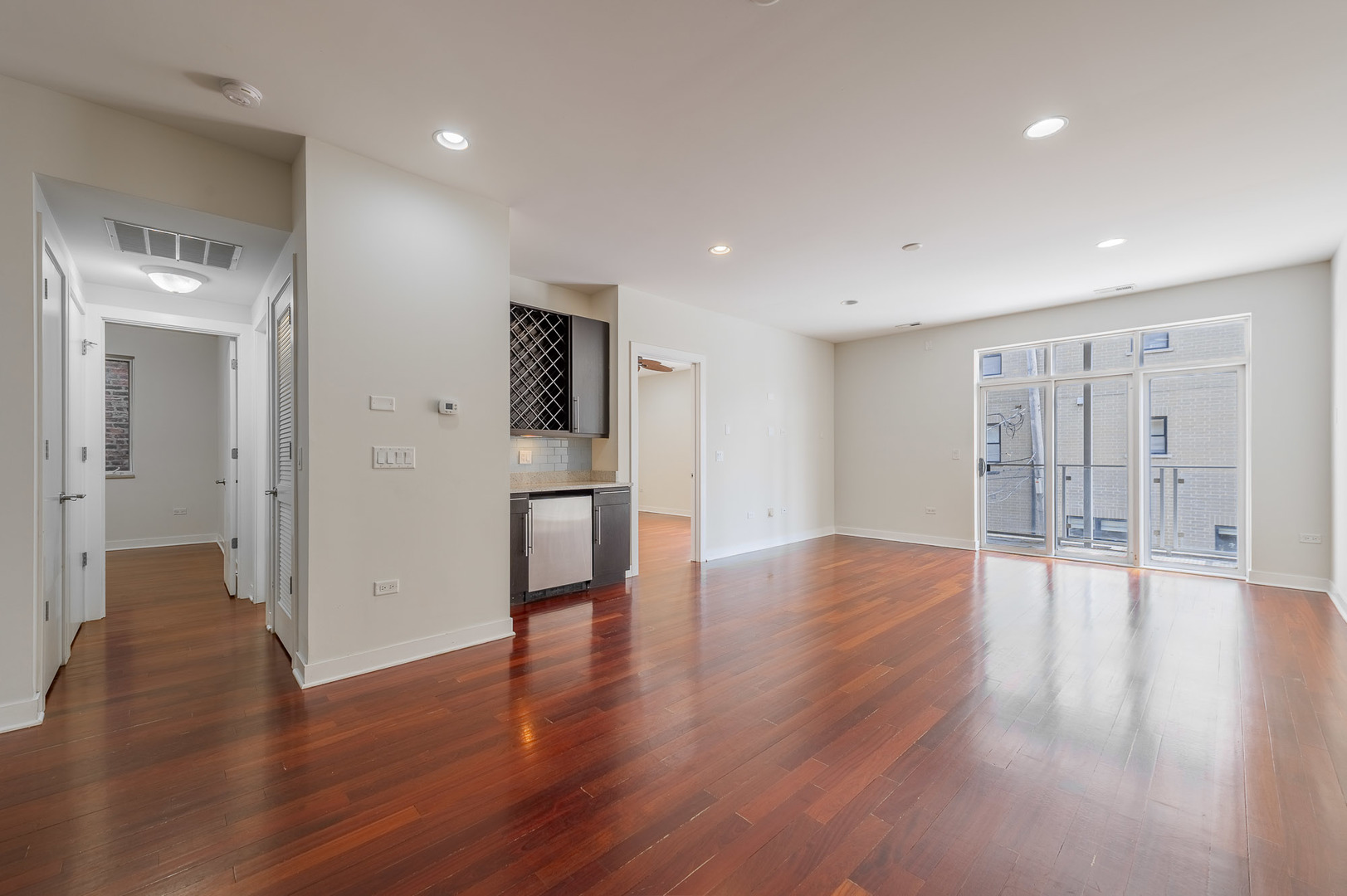 1162 West Hubbard Street, Unit 203 Chicago, IL 60642 - Photo 7 of 22 a view of empty room with wooden floor