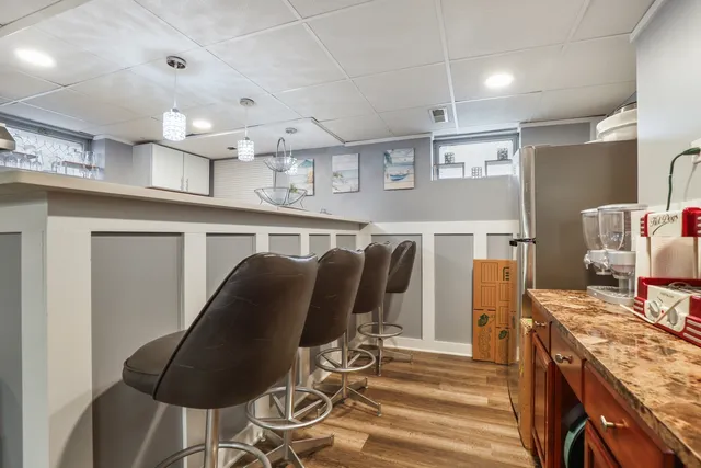 a kitchen with stainless steel appliances granite countertop a stove and a refrigerator