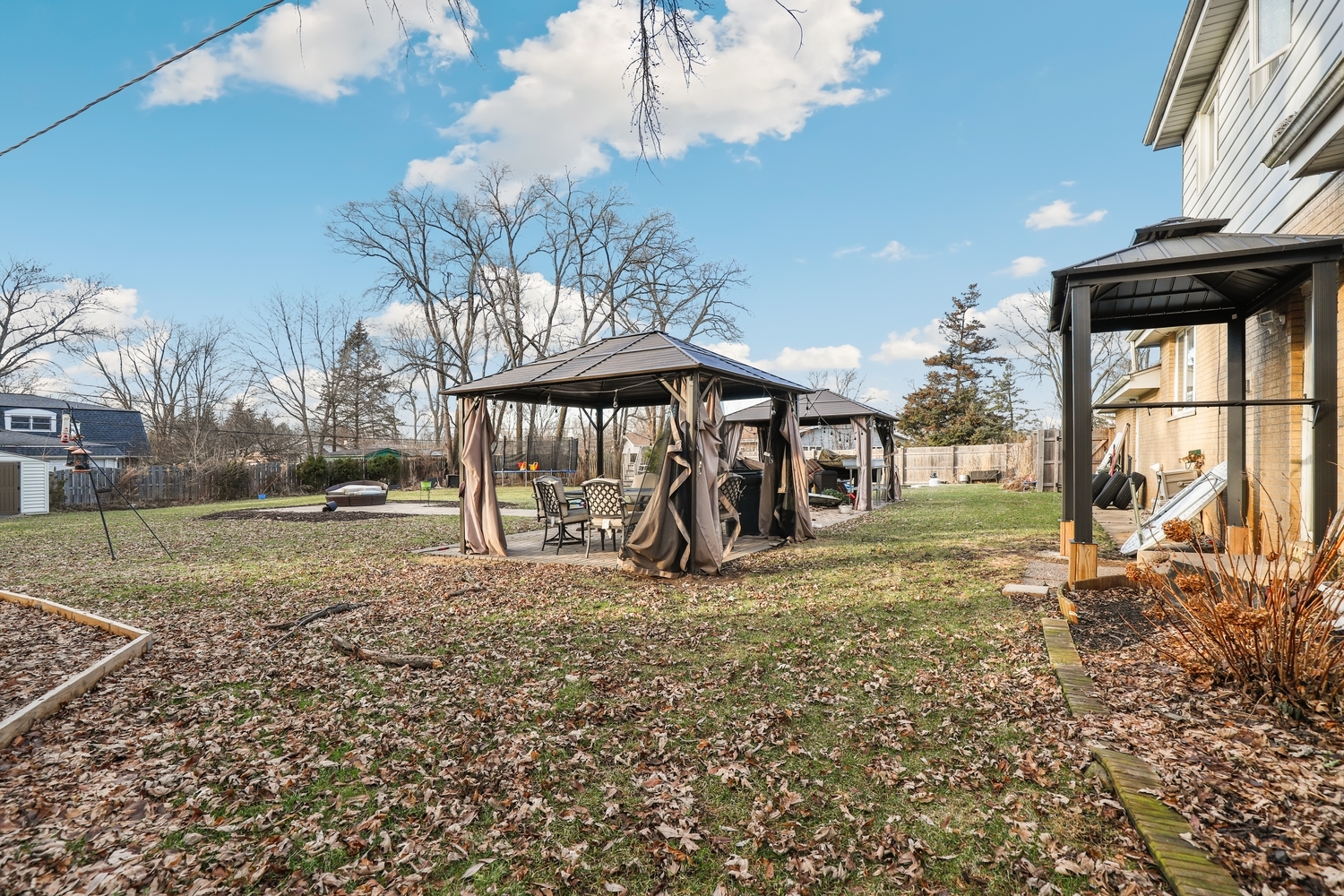 11S450 Carpenter Street Lemont, IL 60439 - Photo 22 of 29 a view of a barn in the middle of a yard
