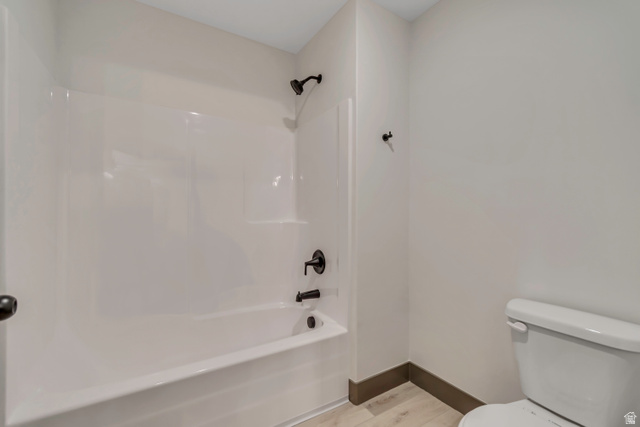 3317 South 1000 West, Unit 6010 Logan, UT 84321 - Photo 27 of 34 Full bath featuring light wood-style flooring and washtub / shower combination