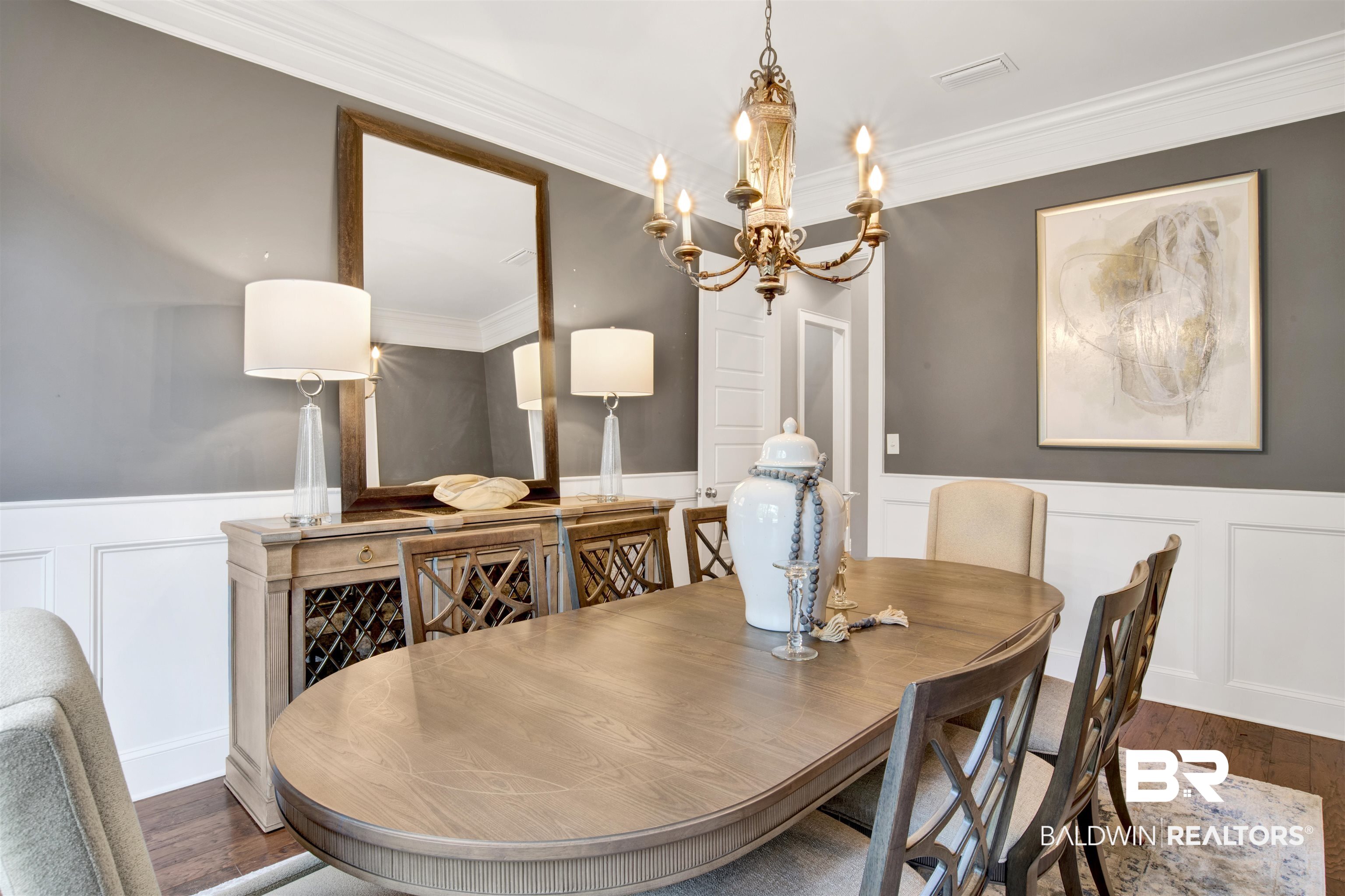 11244 Redfern Road Daphne, AL 36526 - Photo 25 of 50 Dining space with crown molding, a notable chandelier, and dark hardwood / wood-style floors