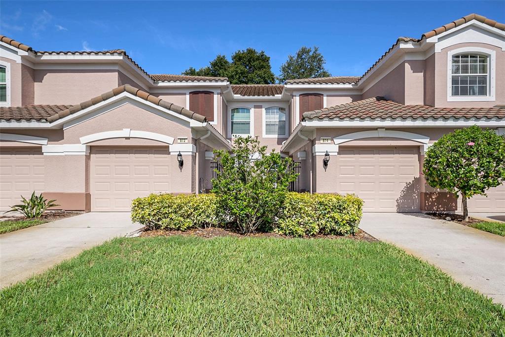 874 Lantern Way, Unit 874 Clearwater, FL 33765 - Photo 1 of 1 front view of a house with a yard