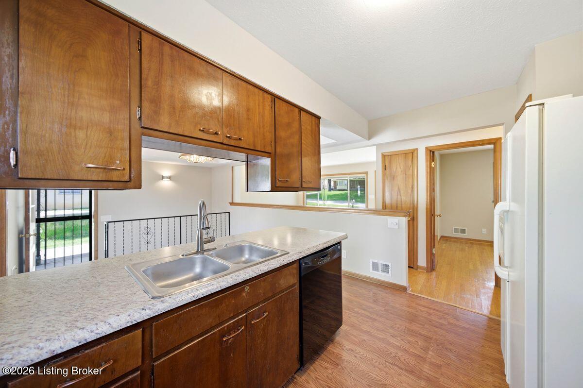 5503 Beth Road Louisville, KY 40219 - Photo 10 of 39 Recently polished laminate flooring, new LED lighting