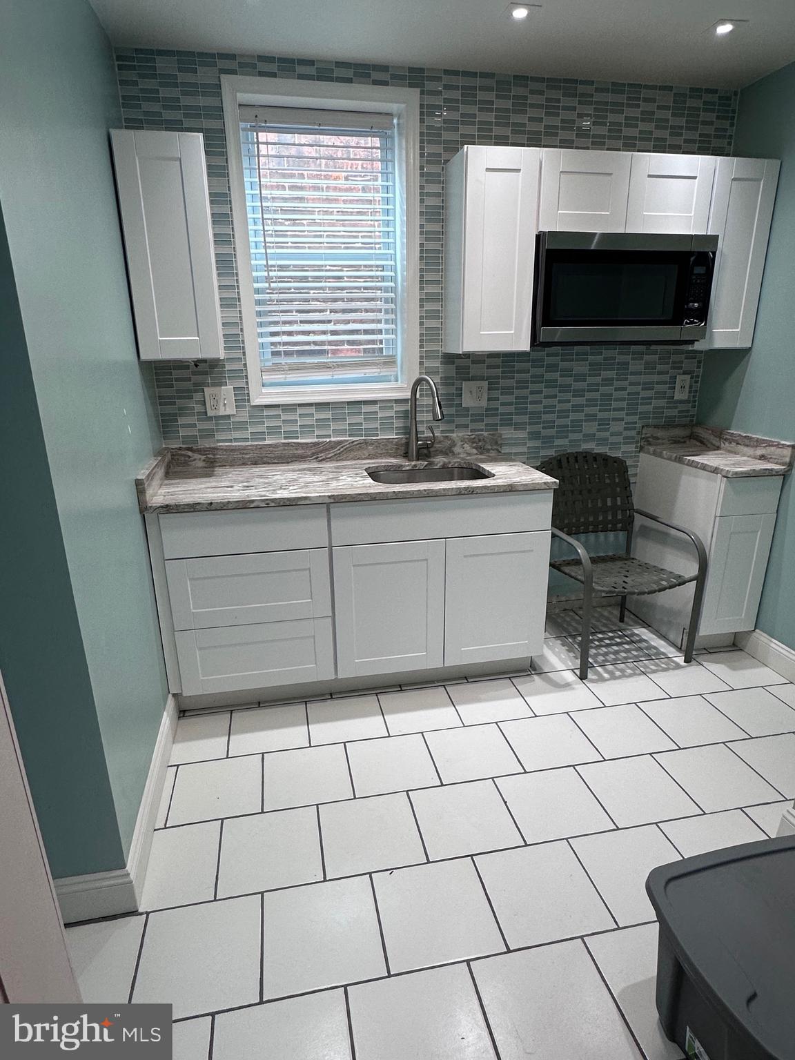 5254 Jefferson Street Philadelphia, PA 19131 - Photo 23 of 30 a bathroom with a sink a mirror and a shower