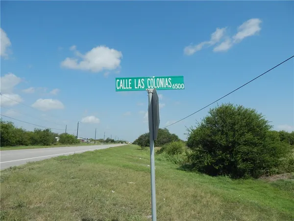 a street sign sitting on the side of a road