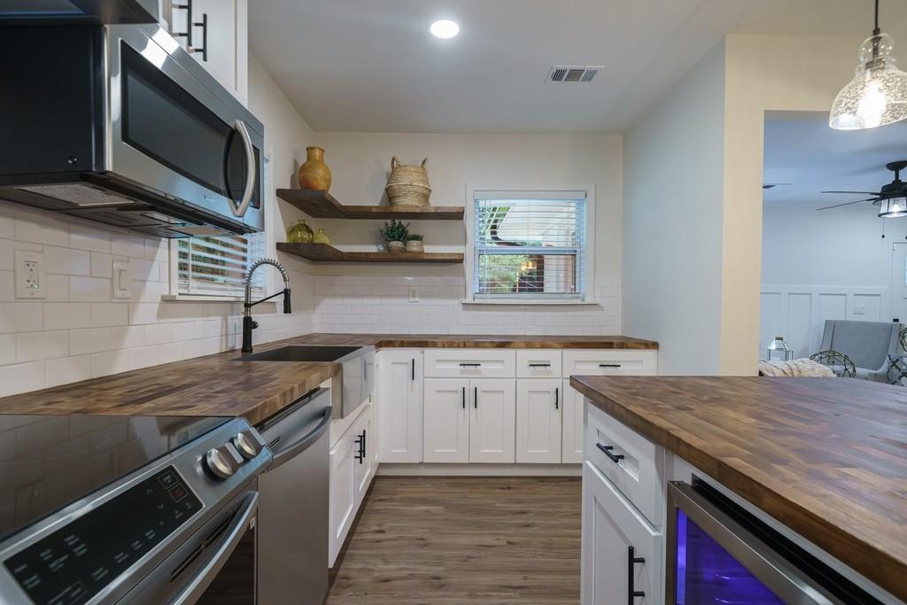 2359 Mark Trail Decatur, GA 30032 - Photo 13 of 35 a kitchen with stainless steel appliances granite countertop a sink and stove