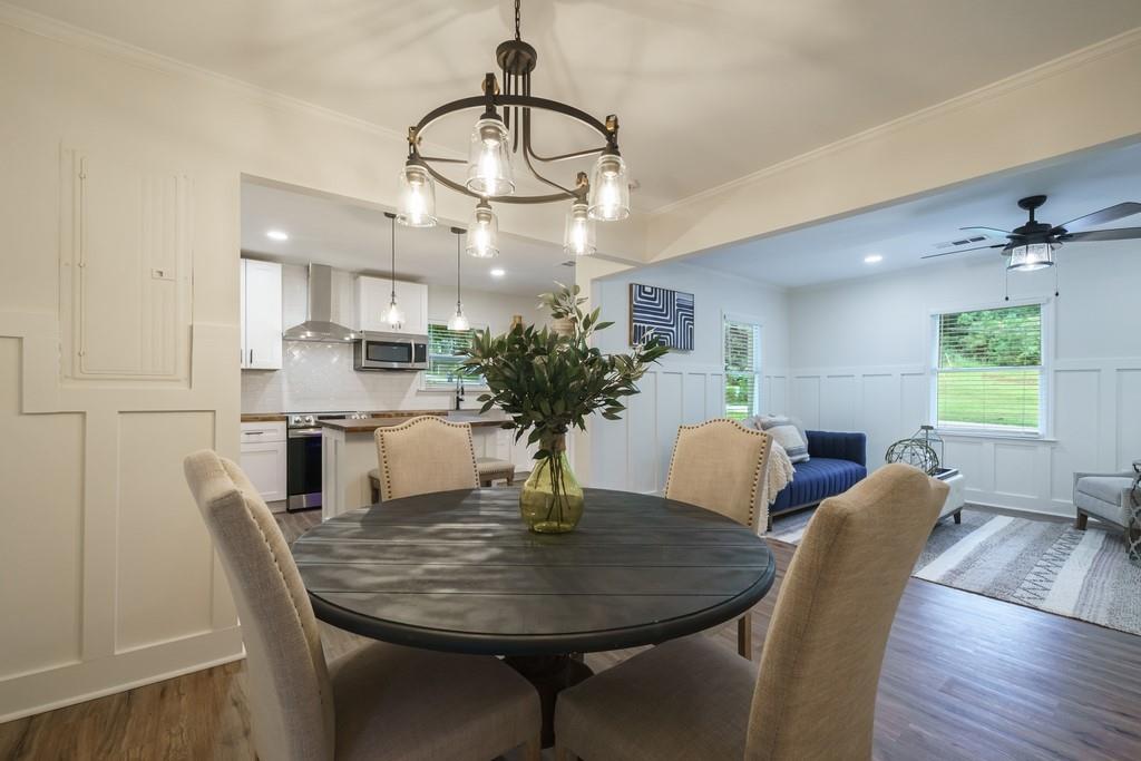2359 Mark Trail Decatur, GA 30032 - Photo 15 of 35 a dining room with furniture a chandelier and wooden floor