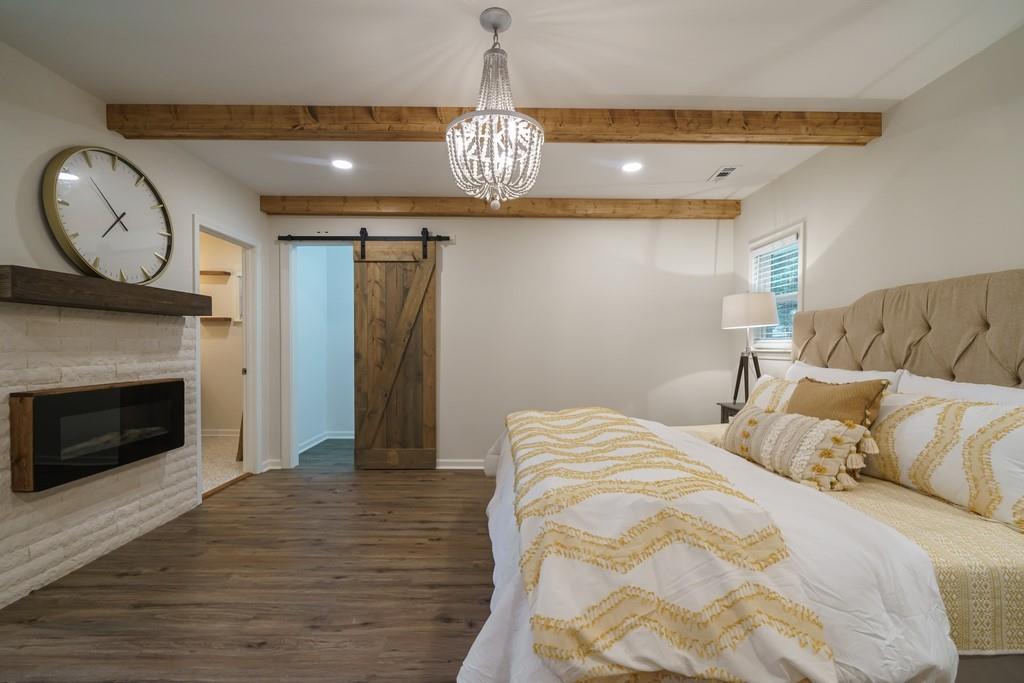 2359 Mark Trail Decatur, GA 30032 - Photo 17 of 35 a bedroom with a bed and a fireplace