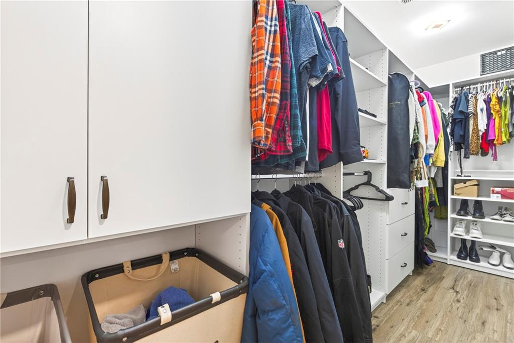 2359 Mark Trail Decatur, GA 30032 - Photo 20 of 35 a view of walk in closet with clothes and shoes