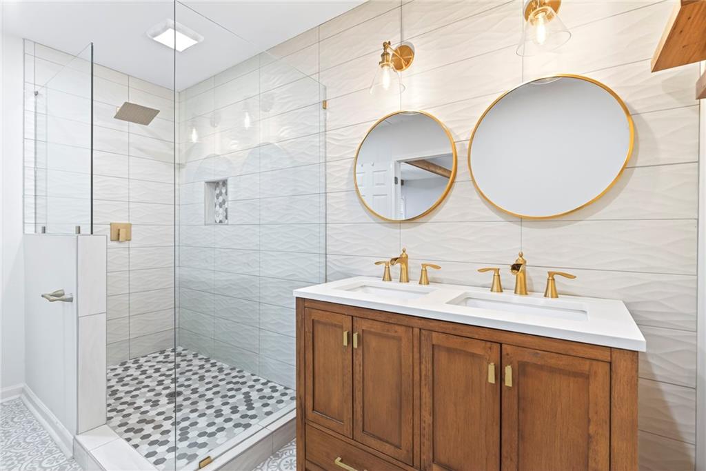 2359 Mark Trail Decatur, GA 30032 - Photo 22 of 35 a bathroom with a sink a toilet and a mirror