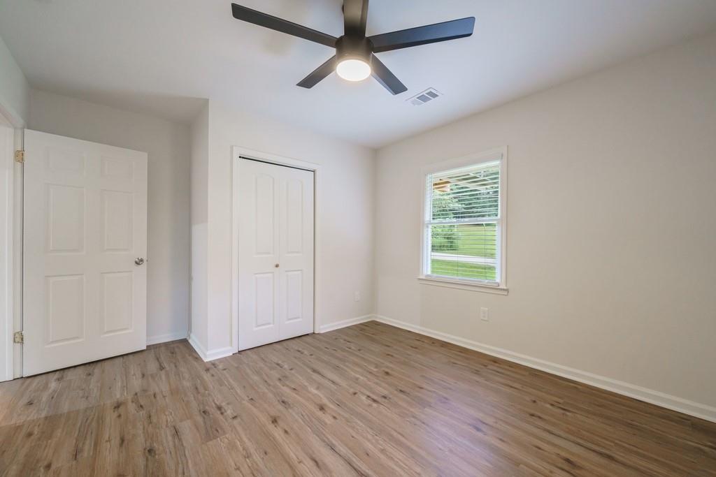 2359 Mark Trail Decatur, GA 30032 - Photo 25 of 35 a view of empty room with wooden floor and fan