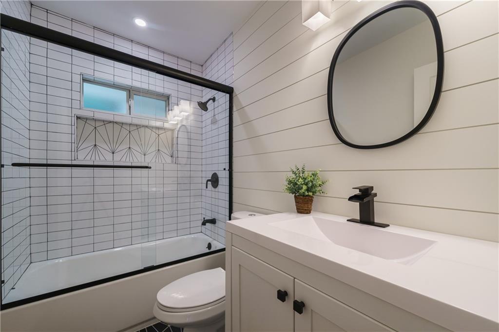 2359 Mark Trail Decatur, GA 30032 - Photo 26 of 35 a bathroom with a sink a toilet and mirror