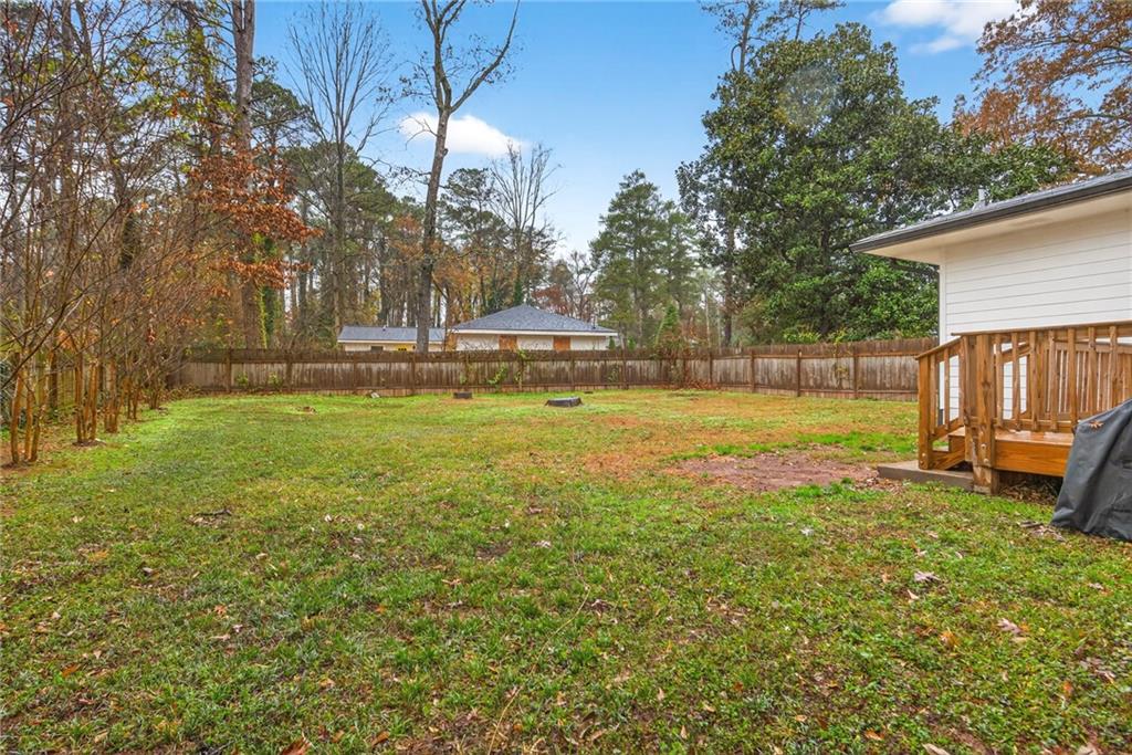 2359 Mark Trail Decatur, GA 30032 - Photo 32 of 35 a view of a large pool with lawn chairs under an umbrella