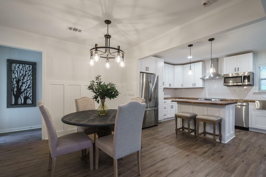 2359 Mark Trail Decatur, GA 30032 - Photo 10 of 35 a kitchen with stainless steel appliances granite countertop a dining table chairs stove refrigerator and cabinets