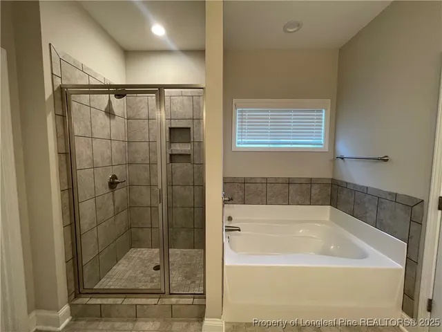 a bathroom with a shower and bathtub