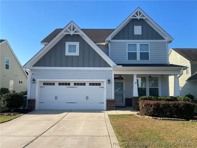 a front view of a house with a garage