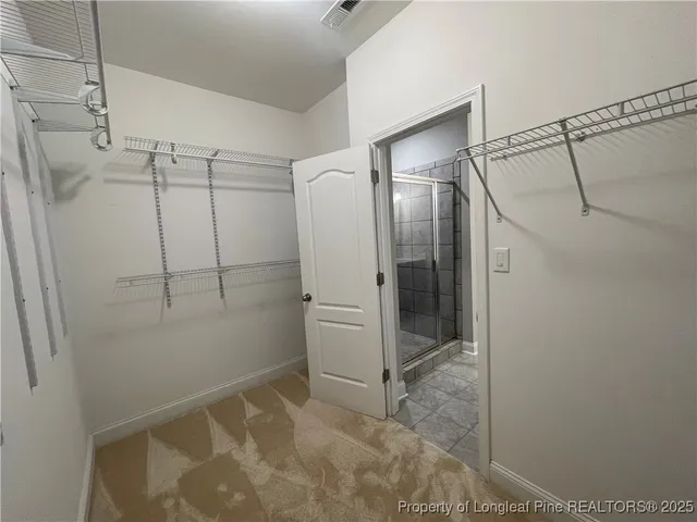 a bathroom with a glass shower door