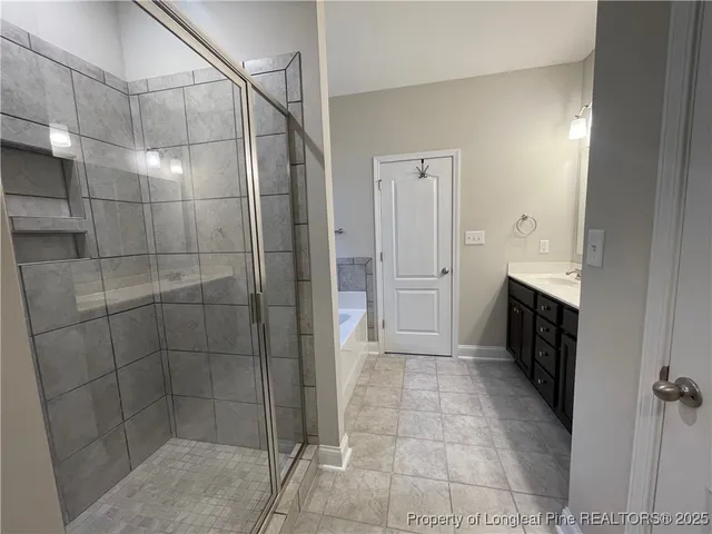 a bathroom with a glass door shower