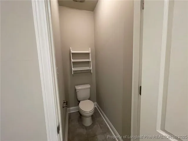 a bathroom with a toilet and a sink
