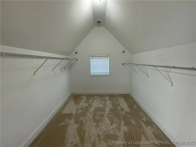 a view of a hallway with a window