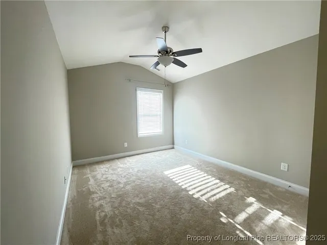 a view of an empty room with windows