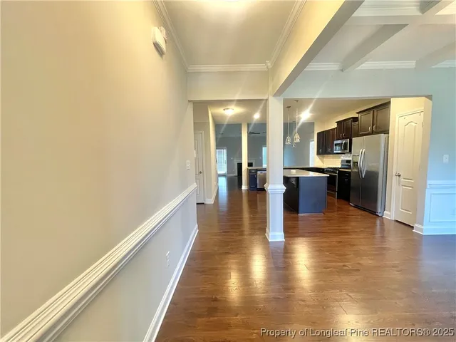 a view of a kitchen with a refrigerator