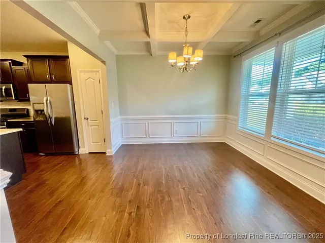 a view of a livingroom with wooden floor