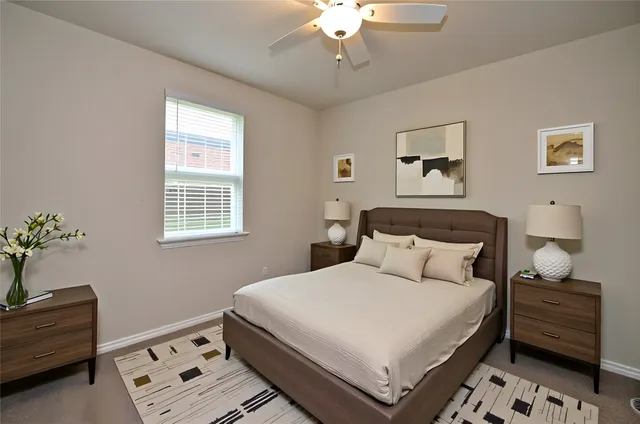 a bedroom with a bed and a window