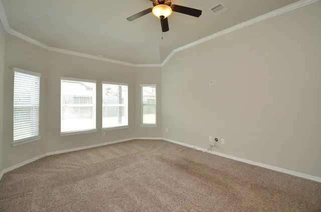 a view of an empty room with a window